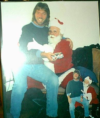 Here's a pic taken several years back.. with me trying to con Santa,that I was a good boy lol,,now my beard almost is as white as his..